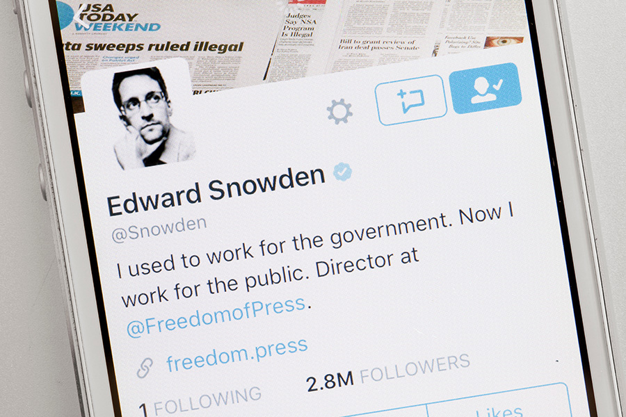Mobile phone screen showing Edward Snowden’s social media account, representing an example of whistleblowing and reporting.